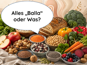 Titelbild zum Ballaststoff-Ratgeber: Eine bunte Vielfalt an ballaststoffreichen Lebensmitteln wie Vollkornbrot, Hülsenfrüchten, Nüssen und Gemüse, darüber eine Sprechblase mit dem humorvollen Text 'Alles „Balla“ oder Was?'